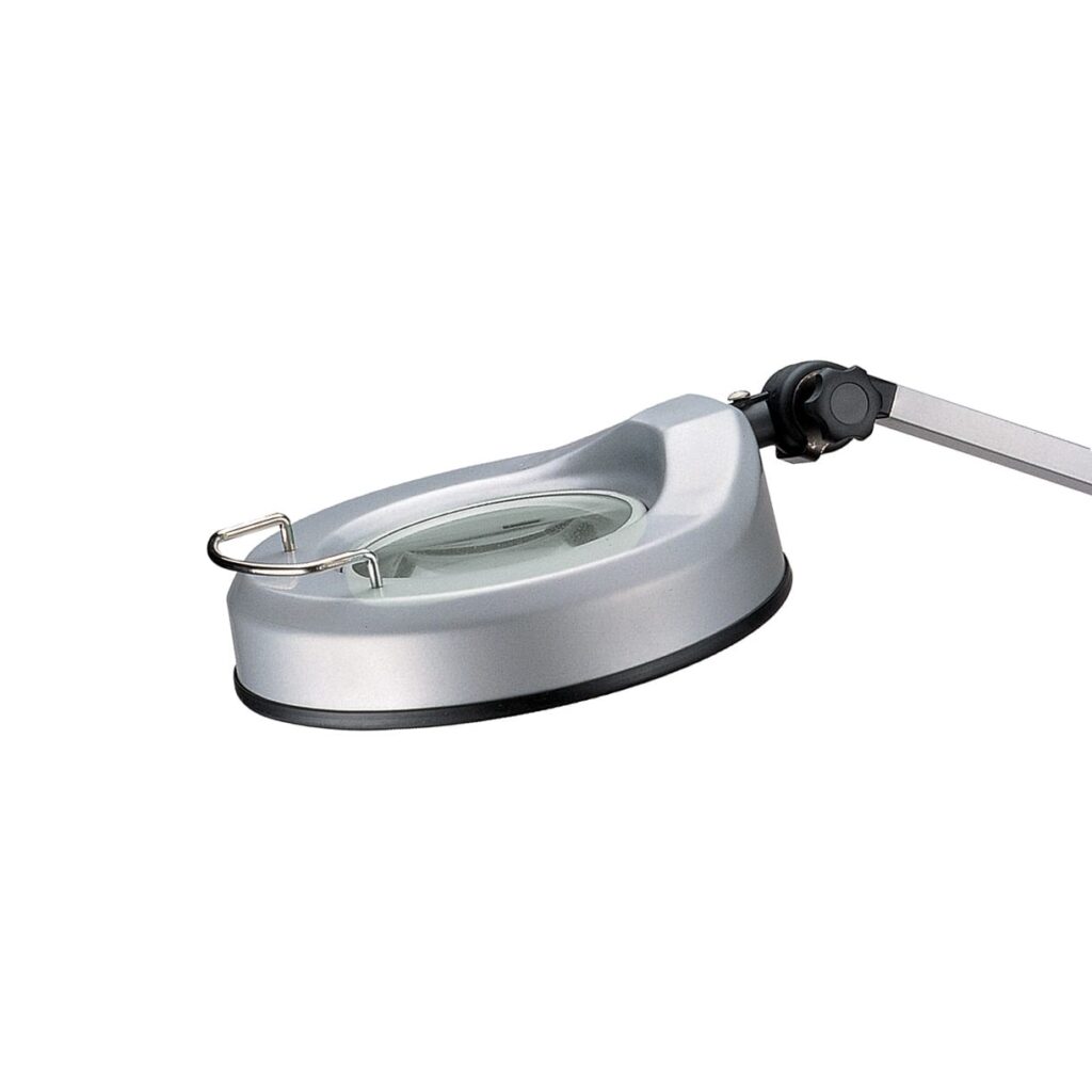 Lampa med inbyggt förstoringsglas för medicinskt bruk